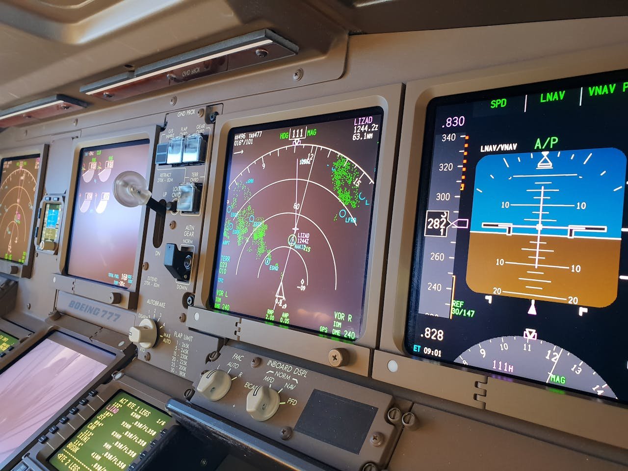 Detailed view of airplane cockpit controls and instruments during daylight.